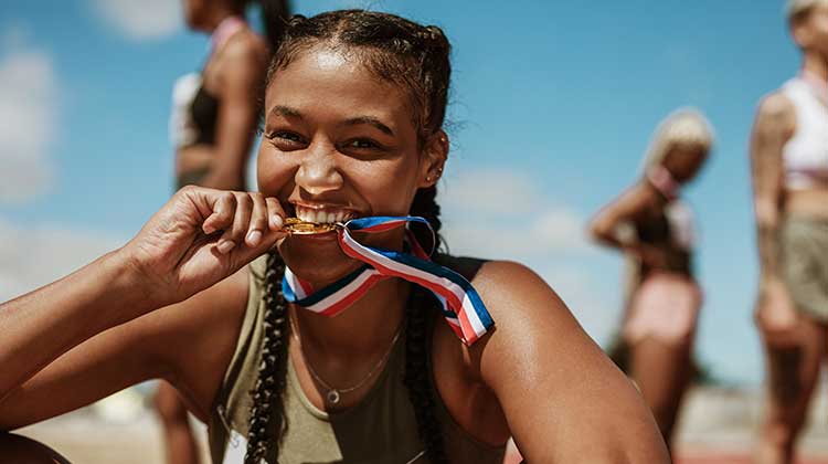 Woman holding medal